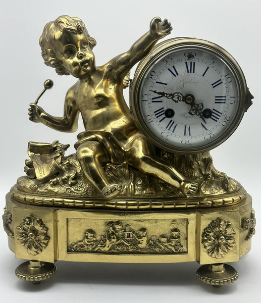 French Mantle Clock Guibel Paris 19th Century. Gilded Bronze Cherub Playing Drum