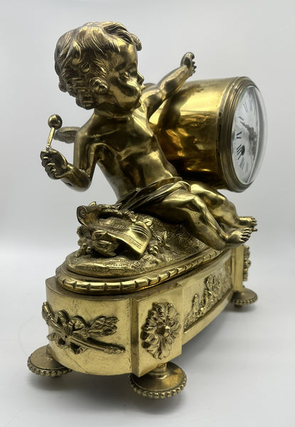 French Mantle Clock Guibel Paris 19th Century. Gilded Bronze Cherub Playing Drum