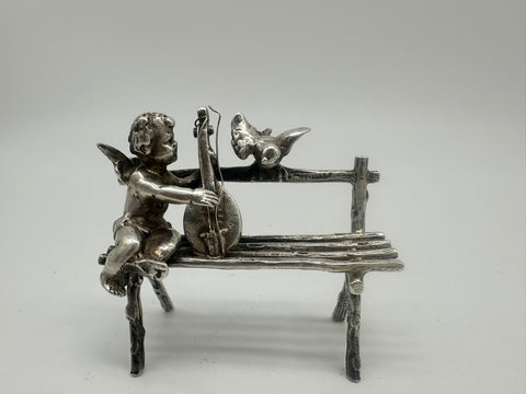 Cherub Seated on Bench Playing Mandolin with Bird. Scottish Sterling. Miniature