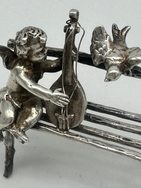 Cherub Seated on Bench Playing Mandolin with Bird. Scottish Sterling. Miniature