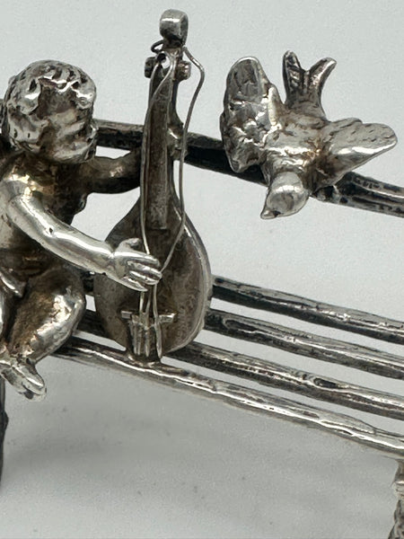 Cherub Seated on Bench Playing Mandolin with Bird. Scottish Sterling. Miniature