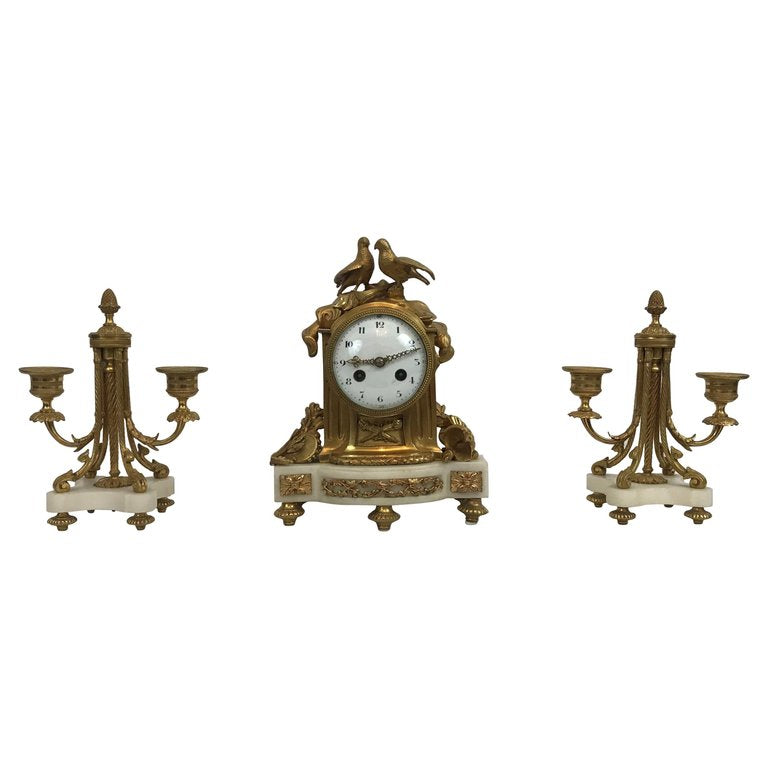 Small French marble and ormolu garniture set clock and candelabra. Vincenti et Cie