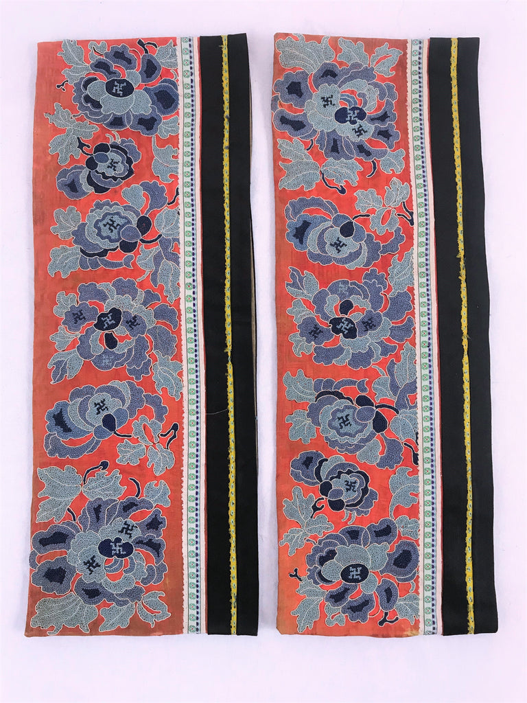 Pair of sleeves. Chinese embroidery on silk. Flowers and Buddhist symbols on red ground. Peking knot, forbidden stitch. Beige ground.  14.5" by 6"