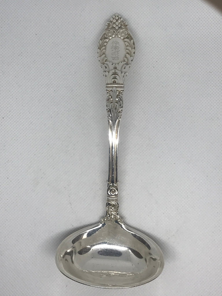 Gravy ladle. J.B. & S.M. Knowles Co., Rhode Island. Sterling silver in the "Roman" pattern (1900). Knowles Co. became Mauser in 1905.  Monogrammed CAWV. Very good condition, nice deep unworn pattern.  6-1/2" length. 2.75 t.oz. 85.3 grams.